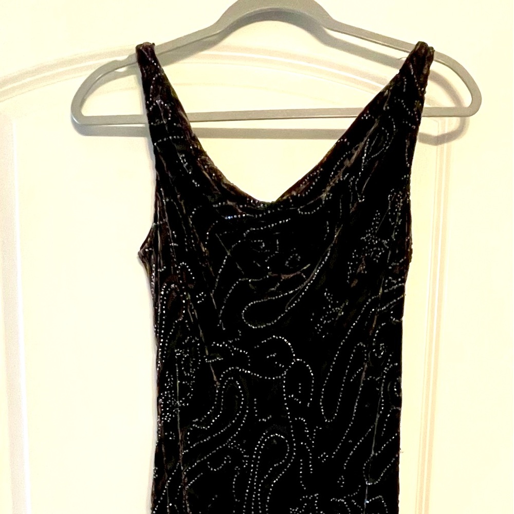 Floor length cowl neck, scoop back deep brown velvet and beaded evening dress.